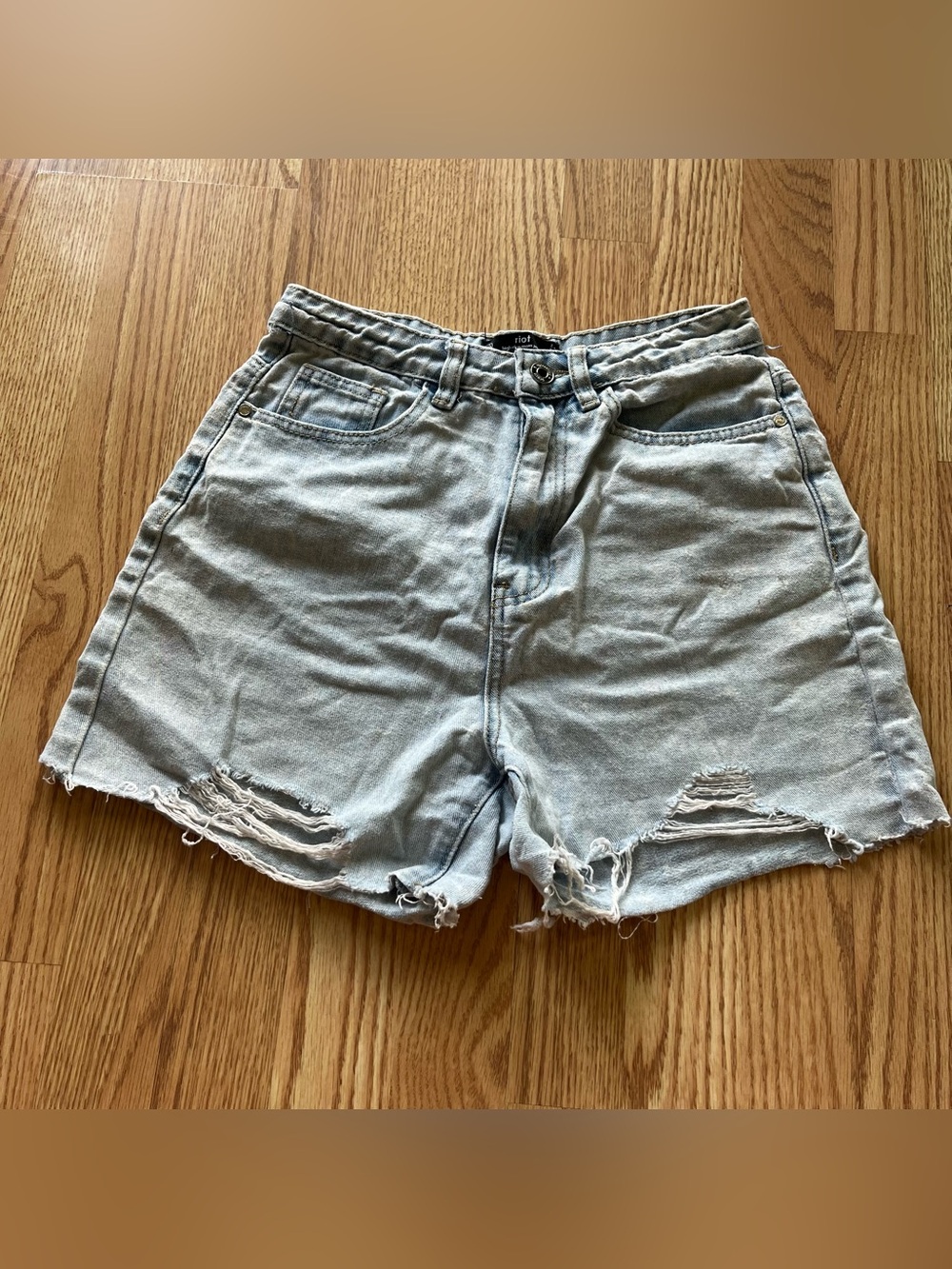Riot light wash distressed denim shorts